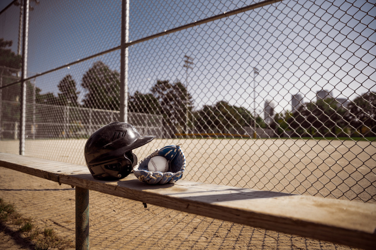 baseball gear behind fence