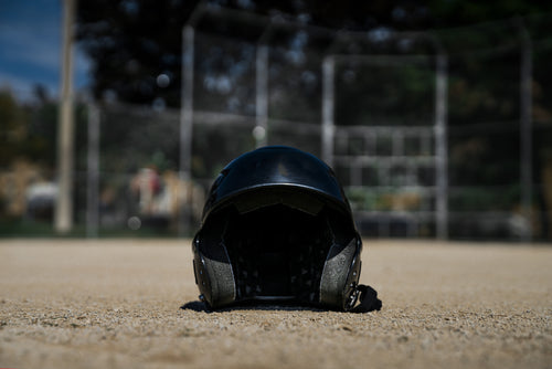 batting helmet in sand