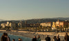 beach and overlooking city with people exploring
