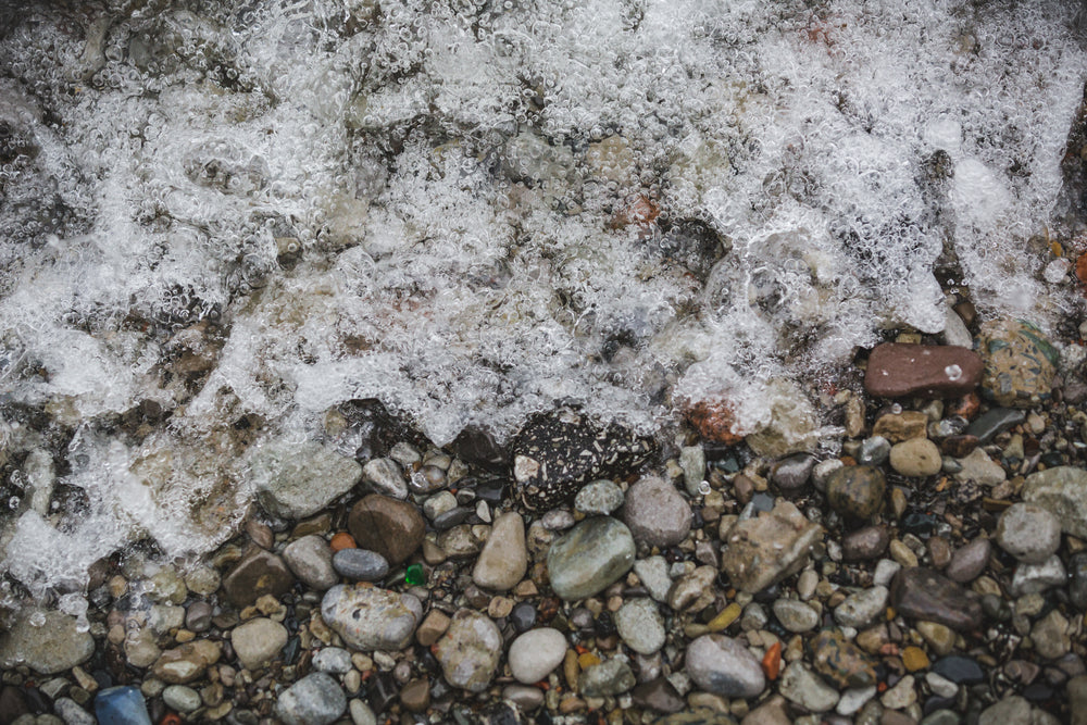 beach surf on stones