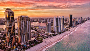 beachfront city at sunset