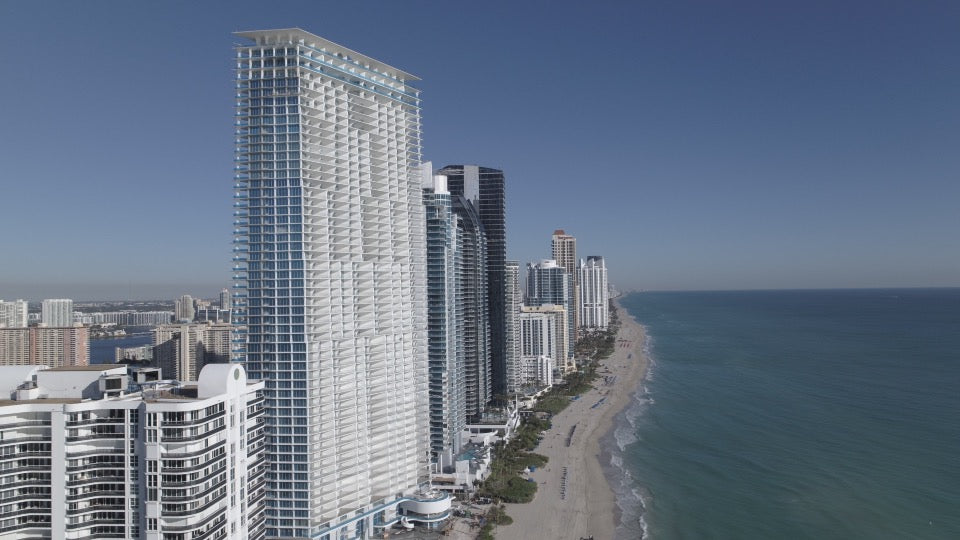 beachside skyscrapes stretch the distance