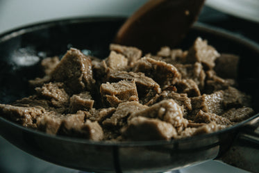 beef being saved in a frying pan