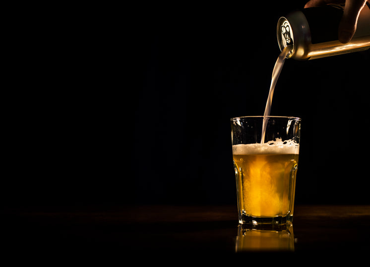 Beer Pouring From Can To Glass