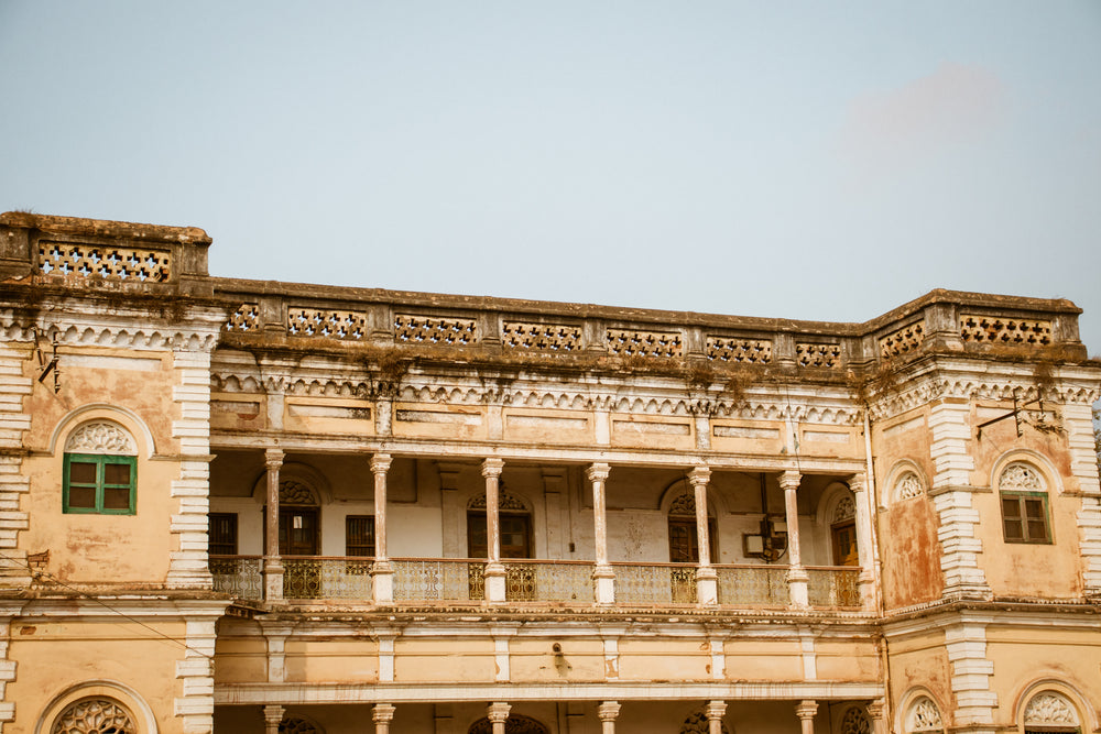 beige and white building with a balcony