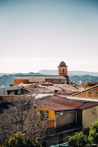 bell tower overlooks buildings