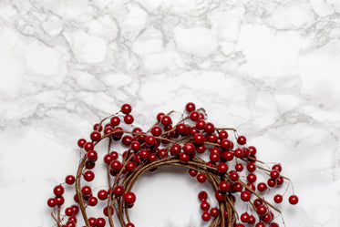 berry wreath on marble