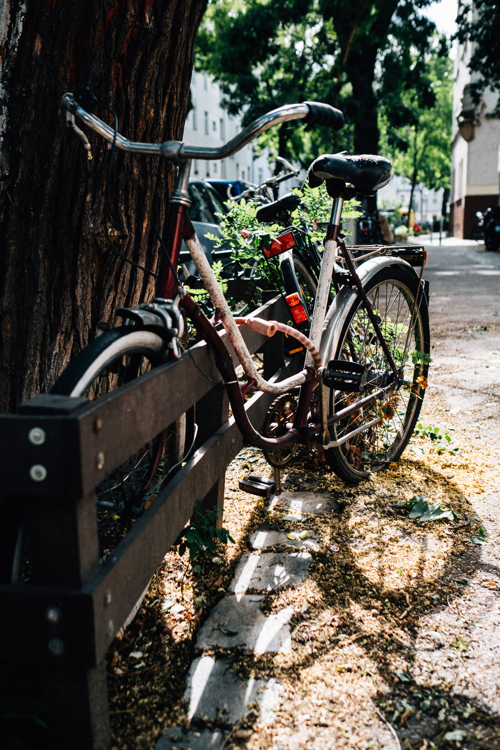 bicycle parked outside on a black fence