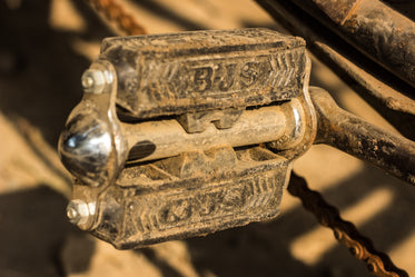 bicycle pedal covered in dirt