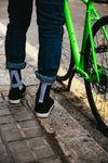 bike & feet by curb