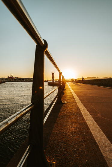 bike path by the water at sunset