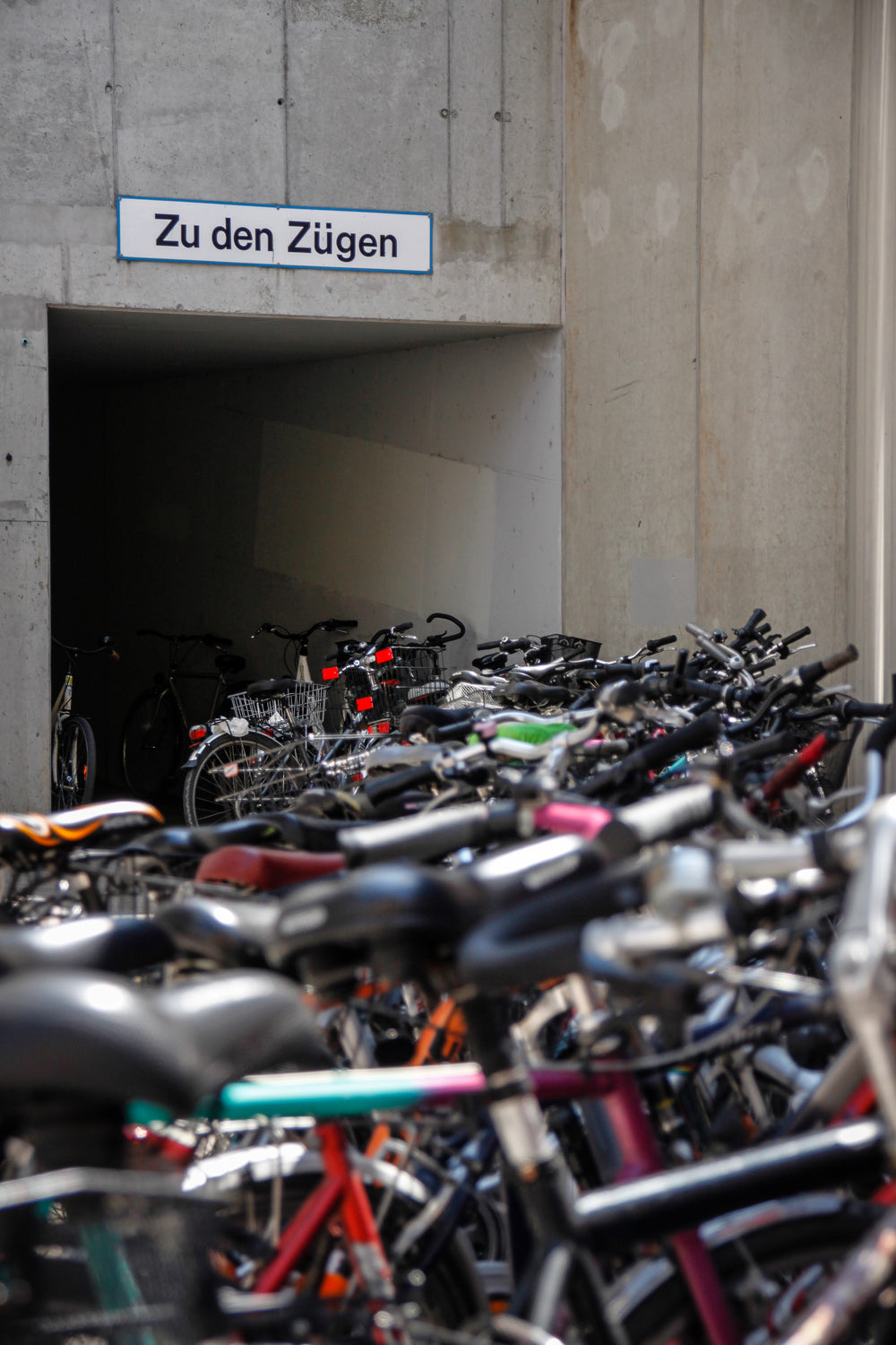 bikes lined up with large building in the background