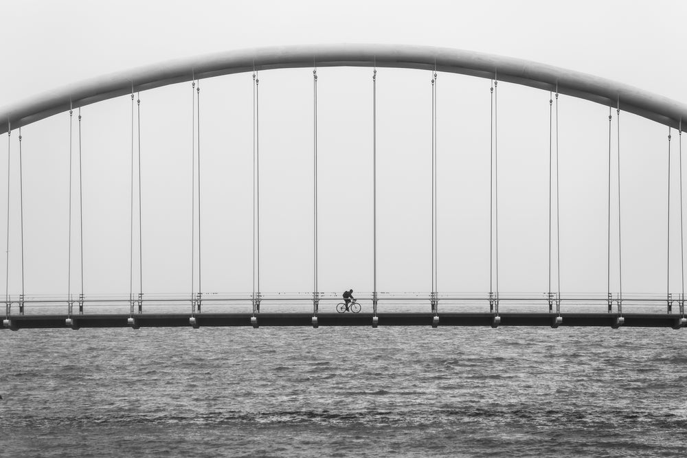 biking over bridge