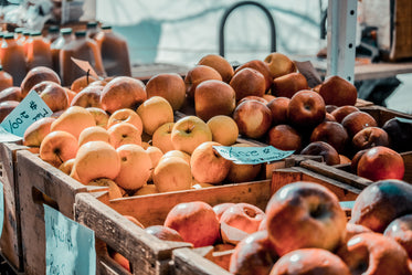 bins of apples at a farmer's market