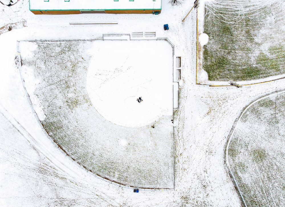 bird's-eye of couple in snow-covered field