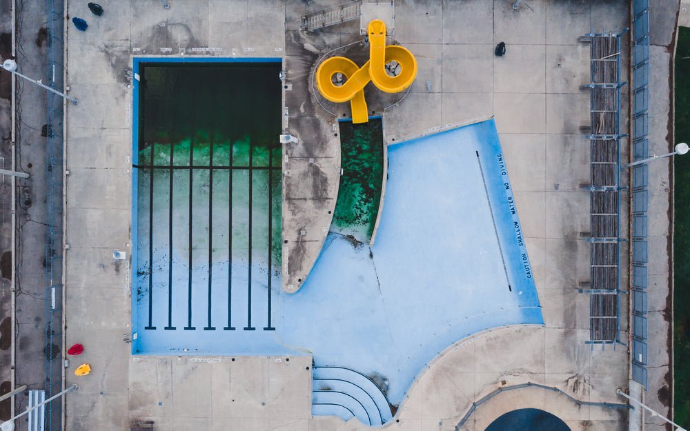 birds eye view of closed pool with waterslide