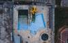 birds eye view of empty pool with waterslide