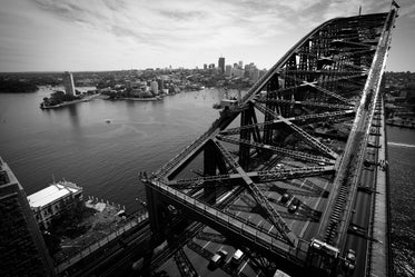 black and white bridge over city