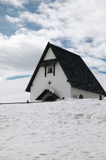 black and white building in snow