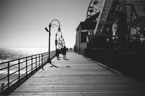 black and white image walking along the boardwalk