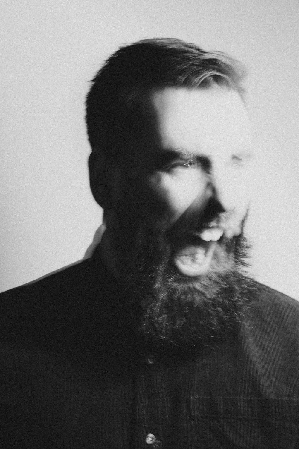 black and white photo of a man yelling