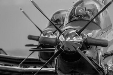 black and white photo of a plane with large front propellers