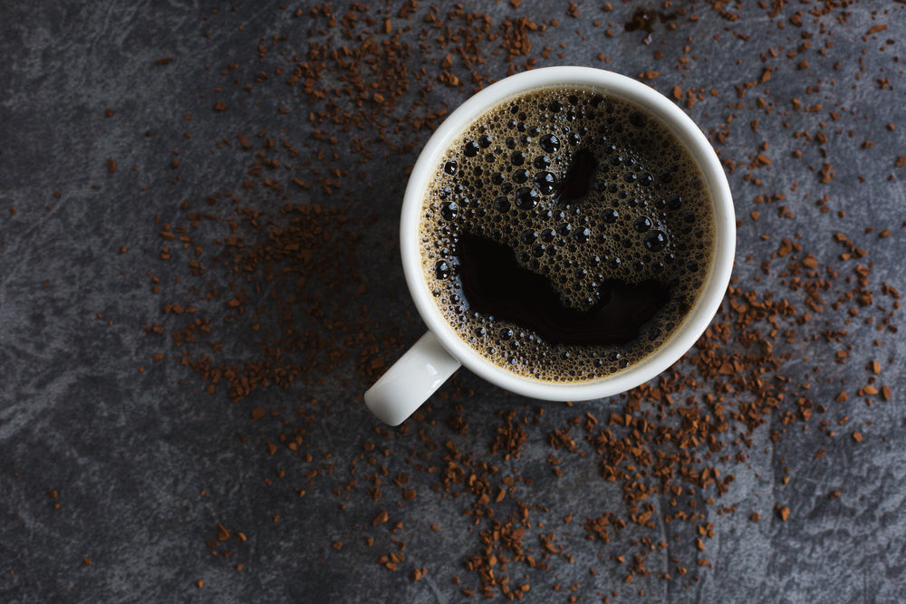 black coffee and spilled instant granules