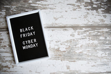 black friday cyber monday sign on woodgrain