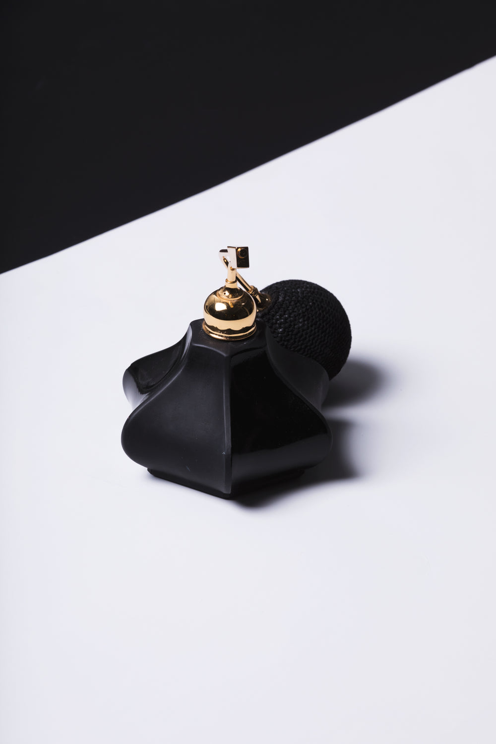 black glass perfume bottle and spritzer