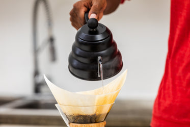 black kettle and pour over coffee close up