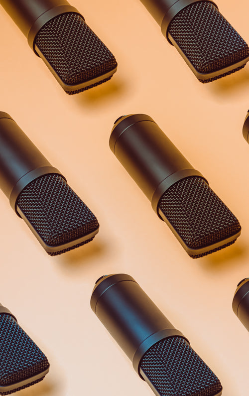 black microphones pattern on a yellow background