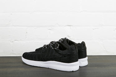 black sneakers with white sole