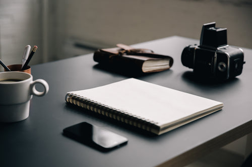 blank notebook on creative workspace