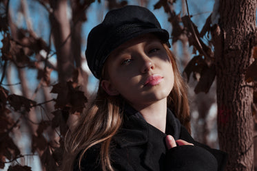 blond woman in black cap