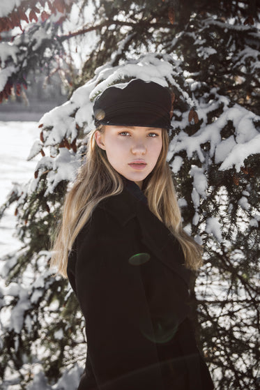 blond woman with winter pine