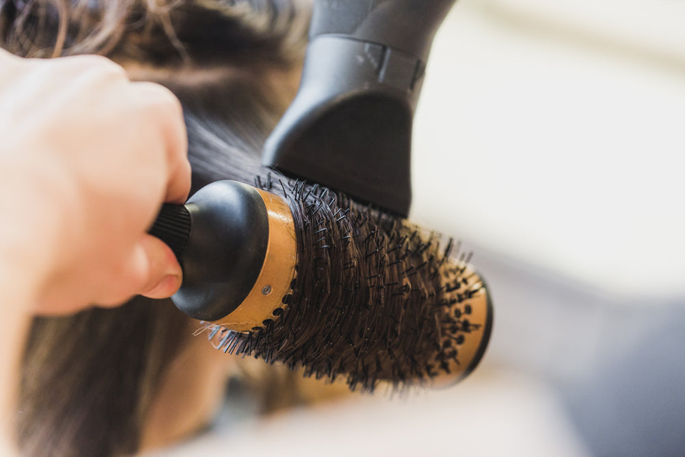 blowdrying hair