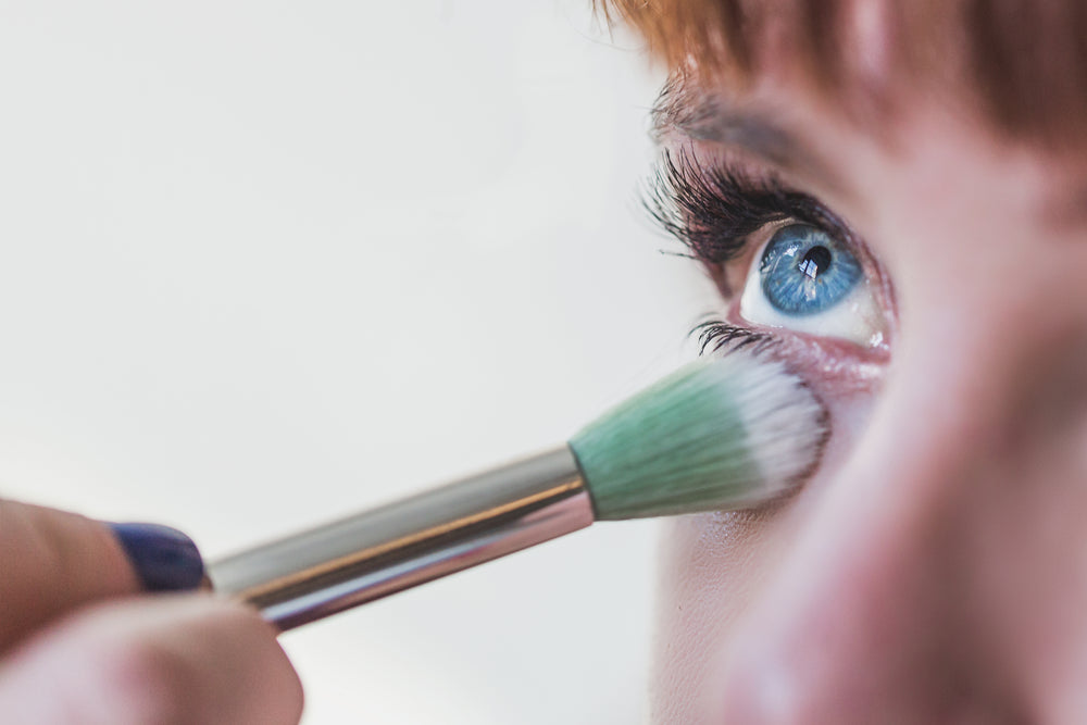 blue eyes getting makeup close up