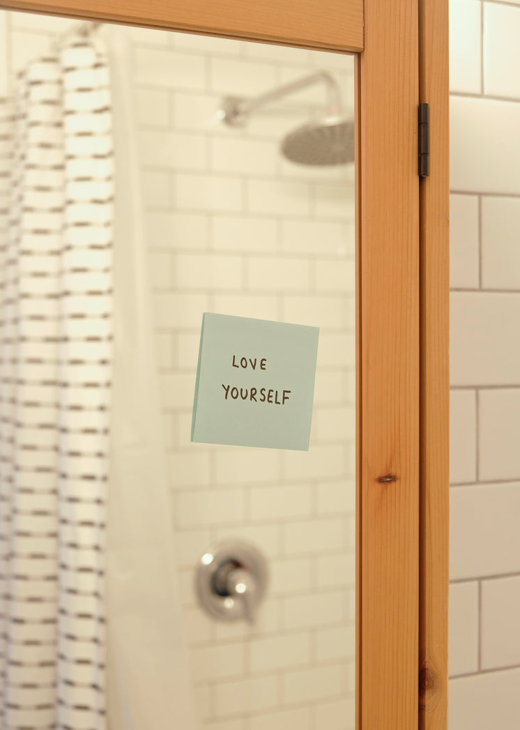 Blue Note On A Bathroom Mirror Reads Love Yourself