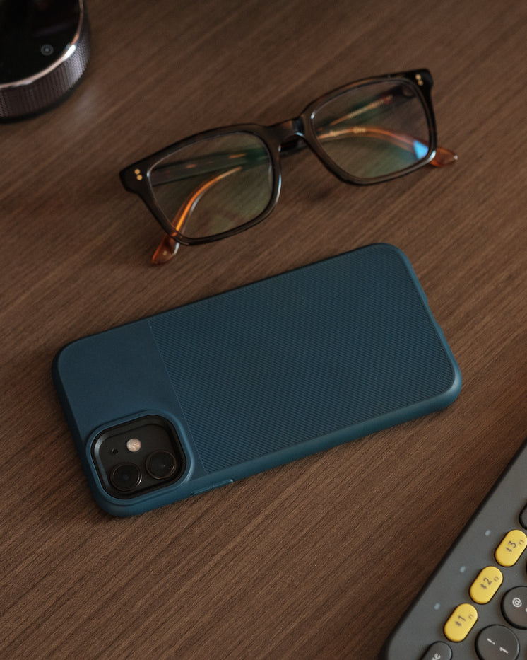 blue-phone-case-and-eyeglasses-on-wooden