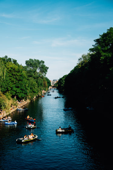 blue river with boaters in the water