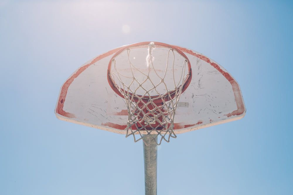 blue sky behind basketball net