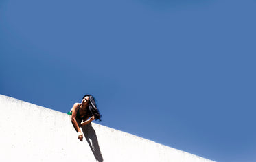 blue sky behind wall with woman