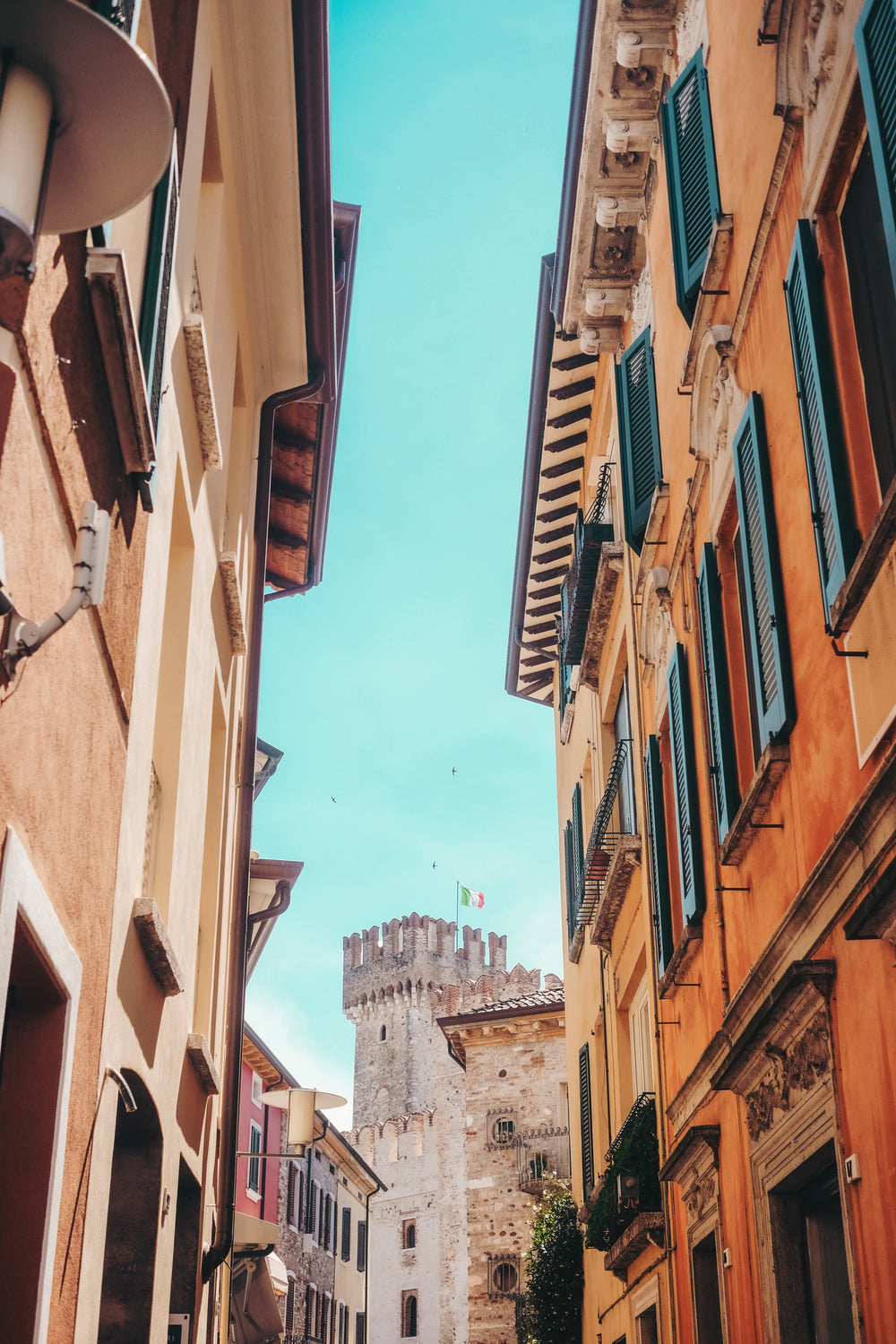 blue skys above colorful buildings and a castle