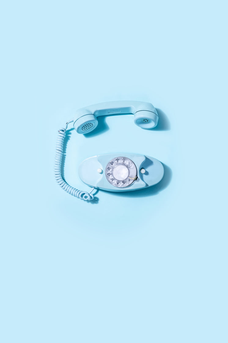 blue-vintage-rotary-telephone-laid-on-bl