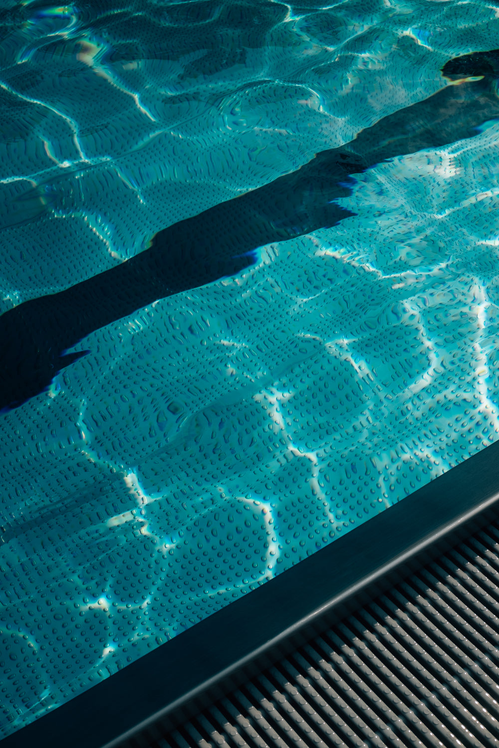 blue wavy water of a swimming pool