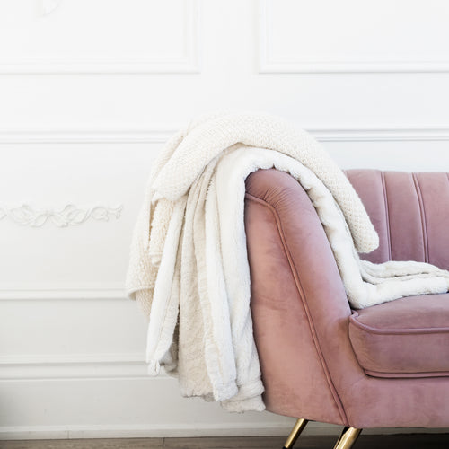 Blush Coloured Couch With Blankets