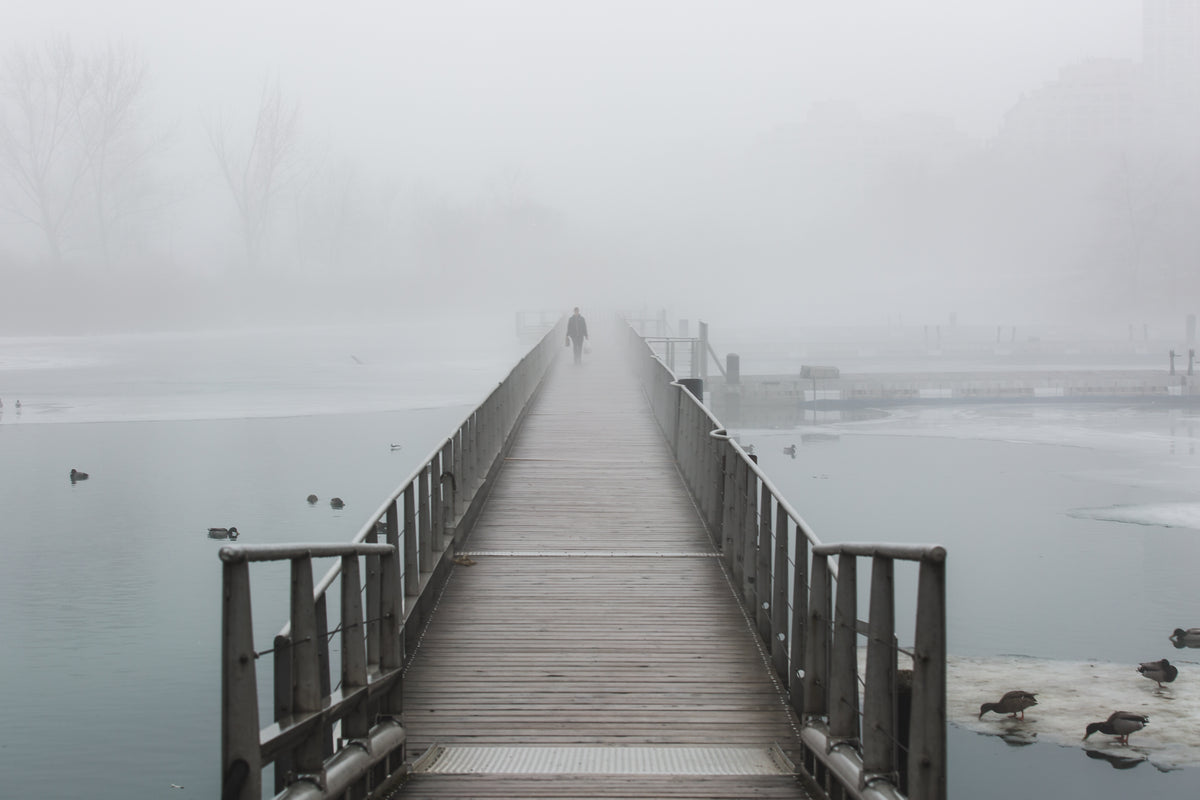 boardwalk on foggy waters