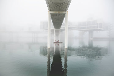 Picture of Boat Under Foggy Bridge - Free Stock Photo
