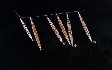 boats moored on dark water