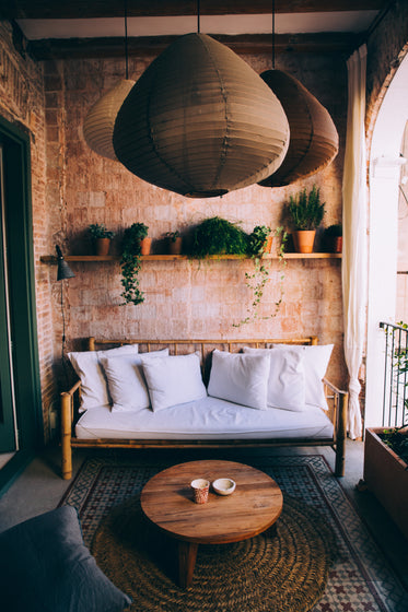 bohemian-style balcony with white bamboo sofa